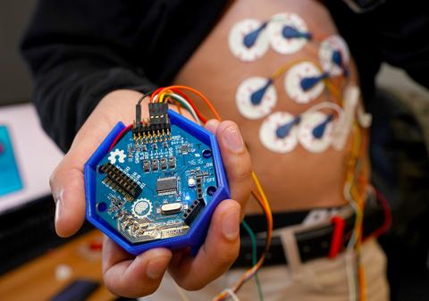 CNT Hackathon participants from team Eggy developed a tool to monitor stomach activity called an “electrogastrogram” (shown). This device provides feedback for the user to help them make adjustments in diet and sleep that will improve their overall health. up-close view of electrogastrogram device