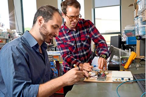 CNT student members, James Rosenthal and Lefteris Kampianakis, working in the lab of CNT member, Matt Reynolds CNT student members, James Rosenthal and Lefteris Kampianakis, working in the lab of CNT member, Matt Reynolds