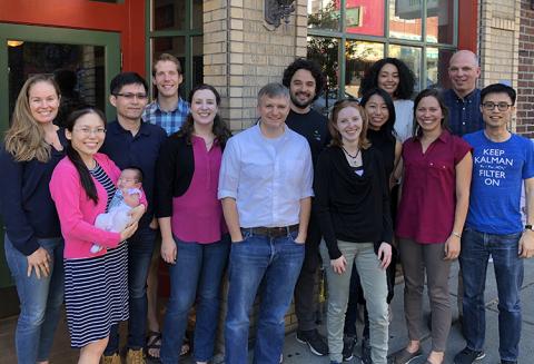 Current and former GRID Lab members, from left to right, Courtnie Paschall, Cathy Wang, Dr. Chao-Hung Kuo, David Caldwell, Kaitlyn Casimo, Kurt Weaver, Gabriel Obregon-Henao, Alainna Brown, Katie Ly, Nile Wilson, Jeneva Cronin, Dr. Jeffrey Ojemann, and James Wu Group of smiling people outside a pub