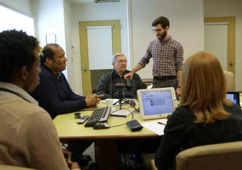 The CNT research team calibrates study participant Fred Foy's implanted deep brain stimulator. The CNT research team calibrating a patient's DBS device