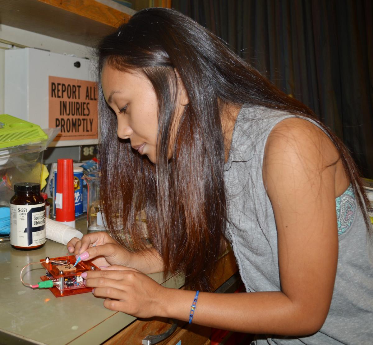 A Young Scholars Program participant at work in the lab