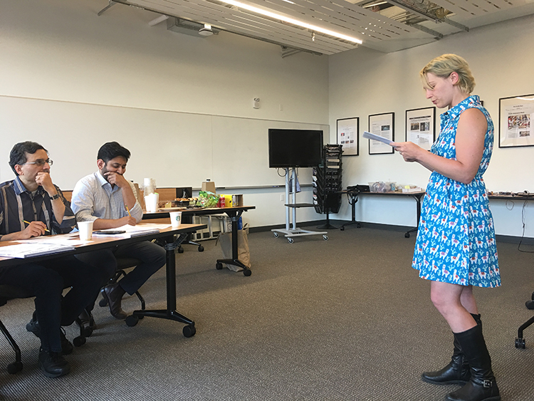 CNT Student Leadership Council Outreach Officer, Claire Rusch, introduces student contestants and their projects to judges at the Ten Hundred Words of Science Competition.