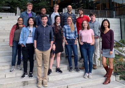 A group of people standing on steps outside