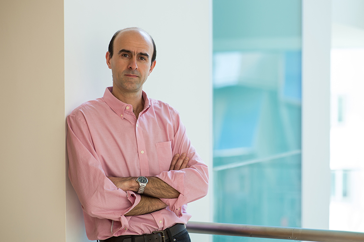 Mehrdad Jazayeri in the hallway of the McGovern Institute for Brain Research at MIT